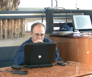 Kim filing copy on Mac G3 aboard Missing Link